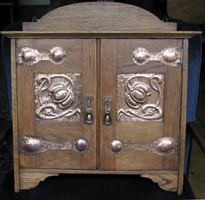 Oak Smokers Cabinet with copper panels and hinges. Shapland and Petter stamped number.