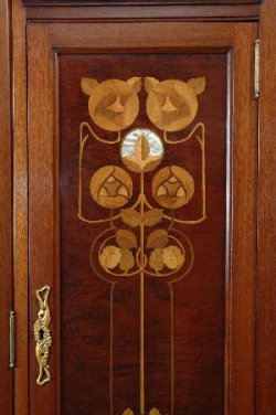 Detail of inlaid panel and gilded escutcheon.