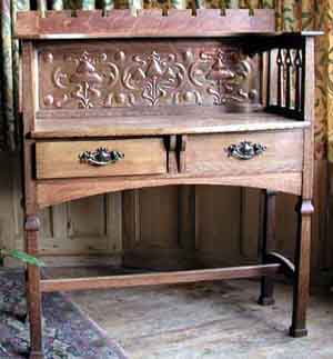  Oak Hall table with long copper panel. Shapland and Petter stamped number. This is from the same suite of hall furniture as the chair above.